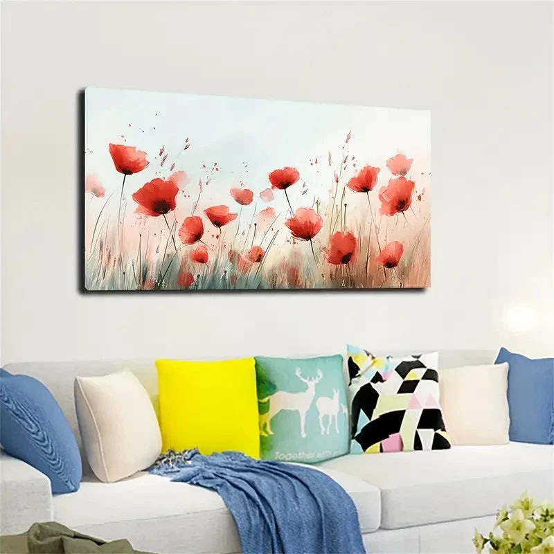 Decorative wall art of red flowers on a white wall above a sofa with colorful pillows.