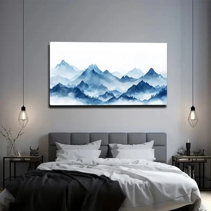 Bedroom with a large wall art of blue mountains above a bed.
