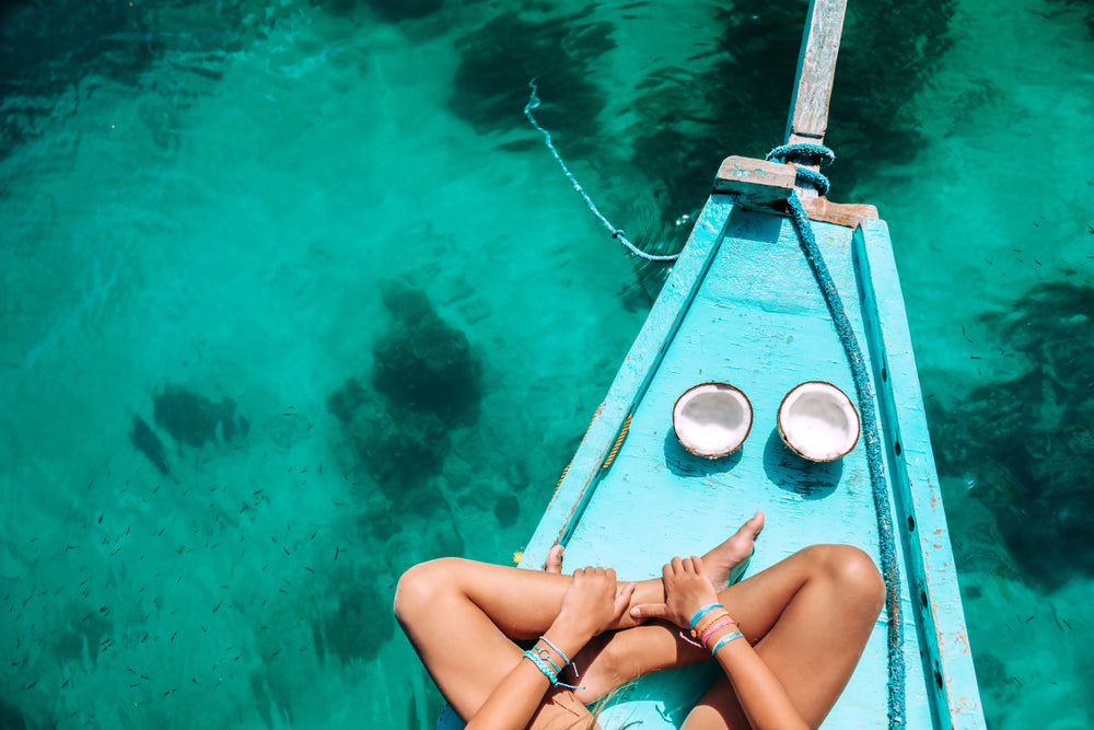 Girl Sitting on Boat with Coconut Photograph Print 100% Australian Made