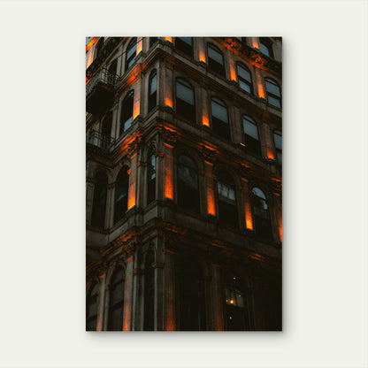 Ornate Building Corner with Warm Orange Lighting 40x60cm Metal Print Ready to Hang