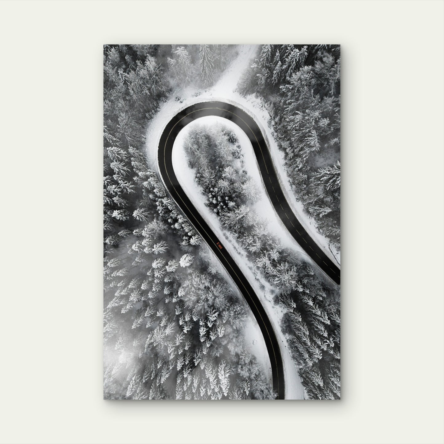 Aerial View of Car on Snow-Covered Winding Road 60x90cm Metal Print Ready to Hang
