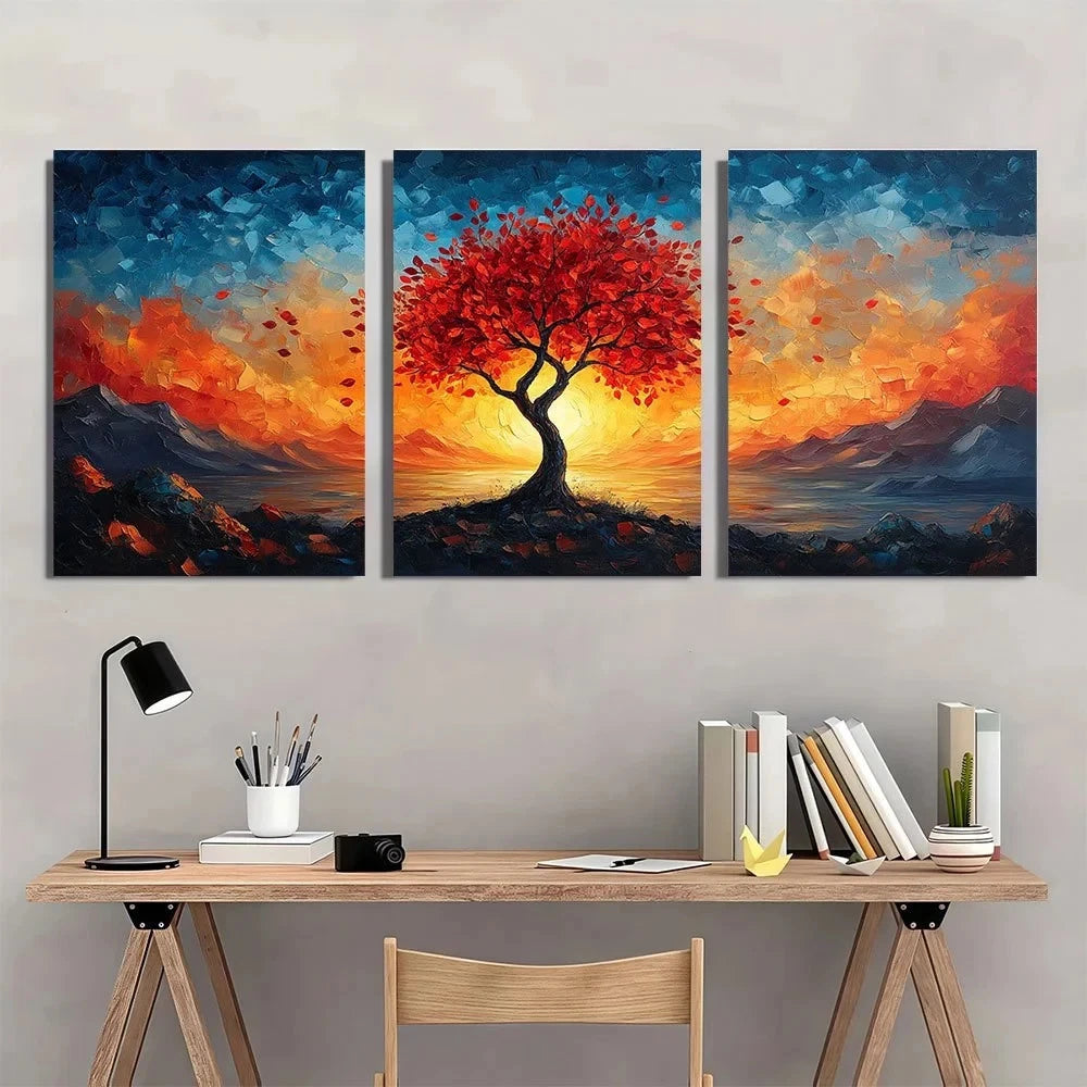 Three-panel painting of a tree with red leaves against a sunset sky, displayed above a desk.