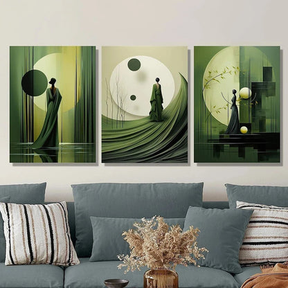 Three abstract art pieces on a wall above a sofa with decorative pillows and a vase.