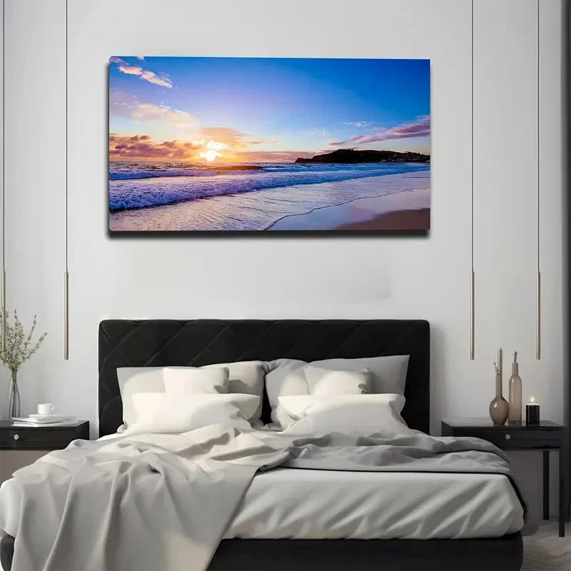 Bedroom with a large wall-mounted canvas displaying a sunset over water.