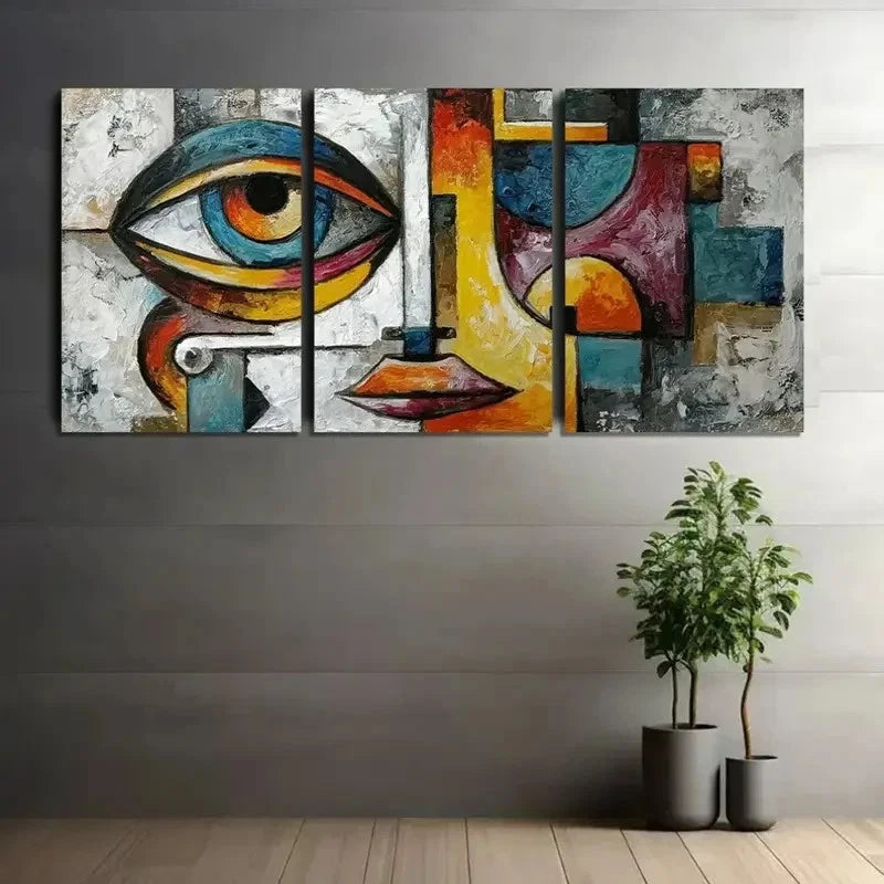Abstract art piece with a colorful eye design on a gray wall, with two potted plants below.