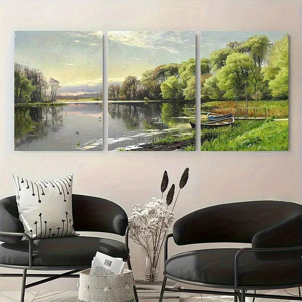 Three-panel painting of a serene landscape with a lake and trees, displayed on a wall above modern black chairs.