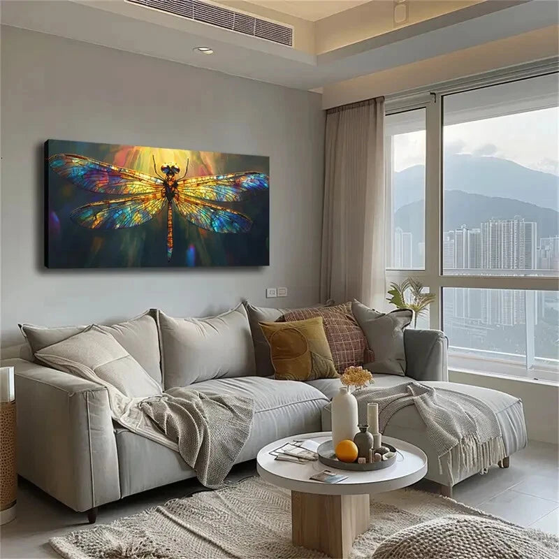 Living room with a large dragonfly painting on the wall, a sofa with pillows, and a coffee table.