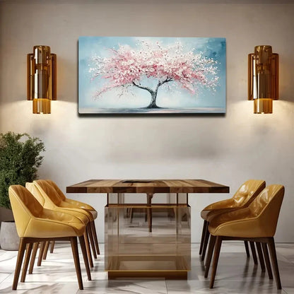 Dining room with wooden table and chairs, wall art of a cherry blossom tree, and wall sconces.