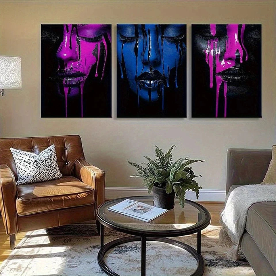 Living room with abstract art on the wall and a brown leather chair.