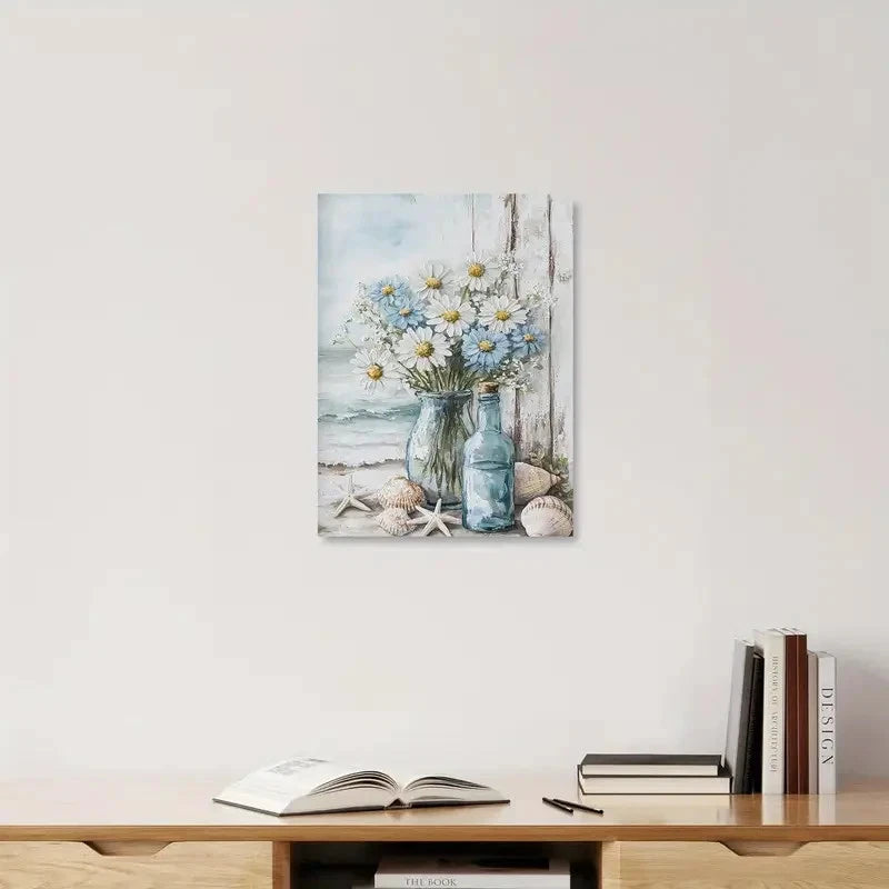 Canvas print of a floral scene with a bottle and seashells on a wall above a shelf with books and an open book.