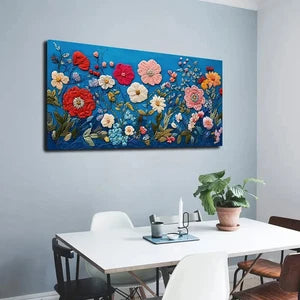 Floral artwork on a wall above a desk with office furniture.