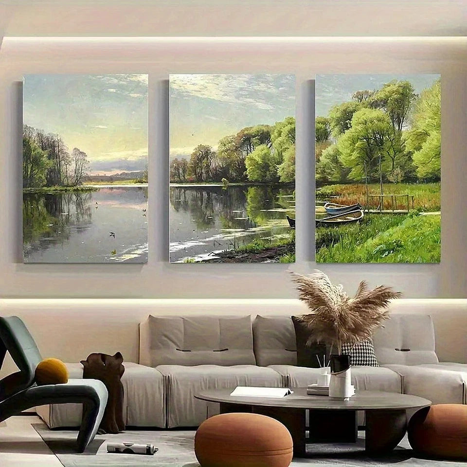 Three landscape paintings above a sofa in a living room