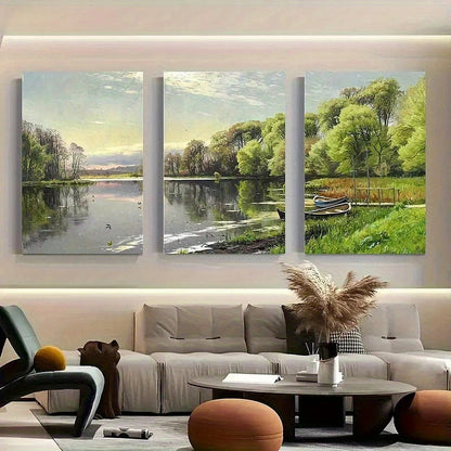 Three landscape paintings above a sofa in a living room