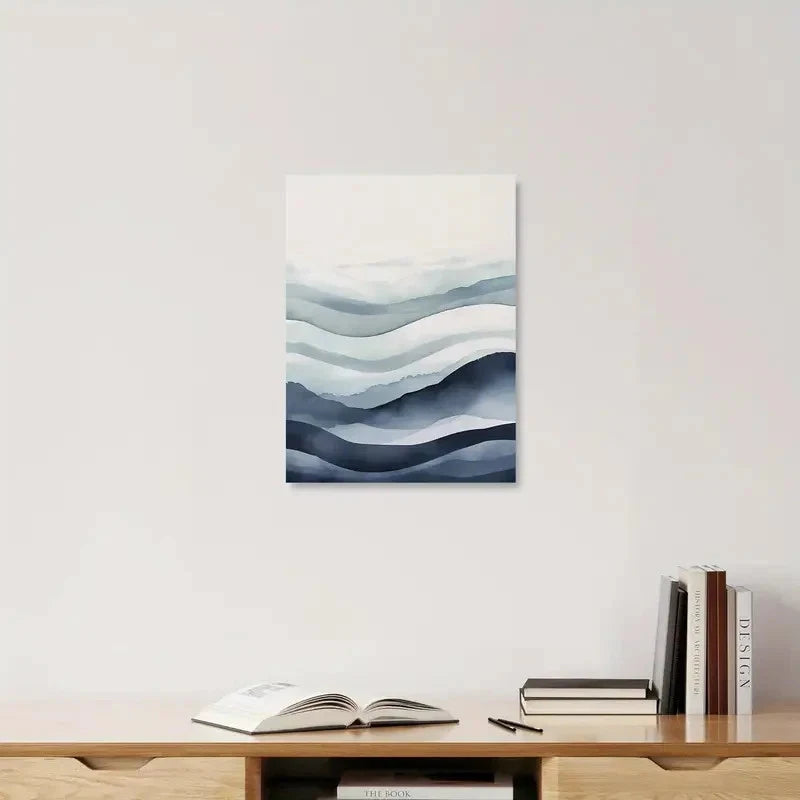 Abstract wave painting on a wall above a wooden shelf with books and an open book.