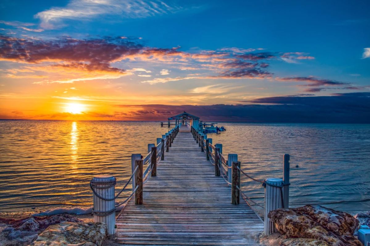 Wallpaper Murals Peel and Stick Removable Wooden Bridge Over Beach at Sunset Photograph High Quality