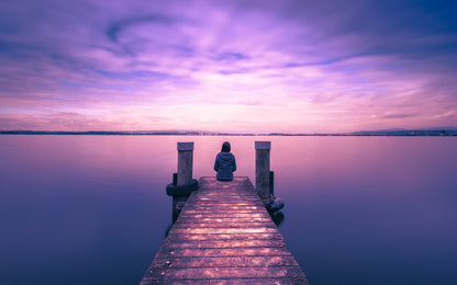 Man Sitting on Wooden Pier Over Lake at Sunset Photograph Print 100% Australian Made