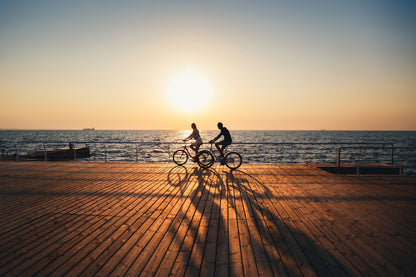 Cyclists Near Sea at Sunset View Print 100% Australian Made