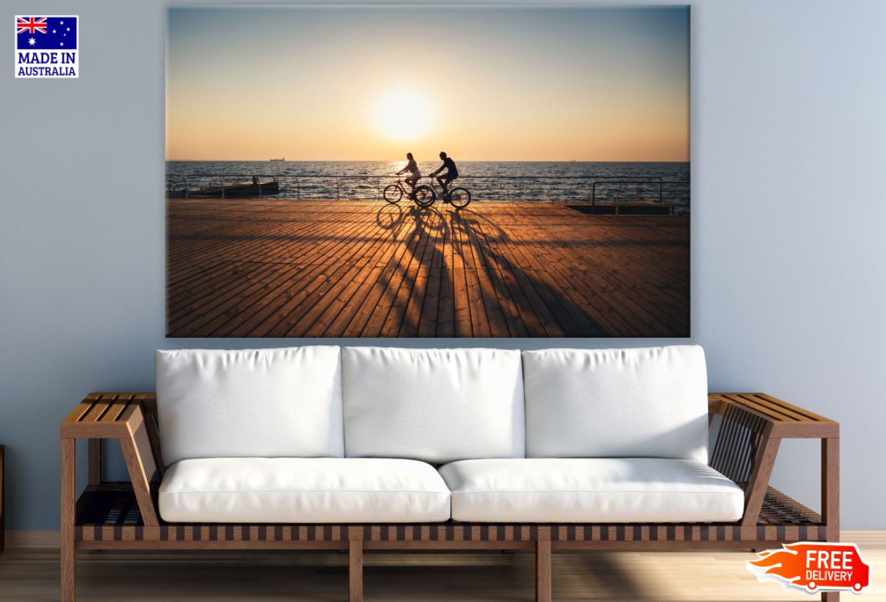 Cyclists Near Sea at Sunset View Print 100% Australian Made